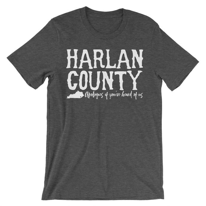 Dark grey heather tee with vintage distressed print with the words Harlan County apologies if you've heard of us.
