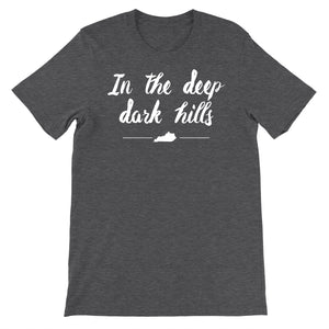 Dark grey heather tee with vintage distressed print with words In the deep dark hills.