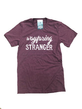 blush tee with vintage distressed print that says Wayfaring Stranger.